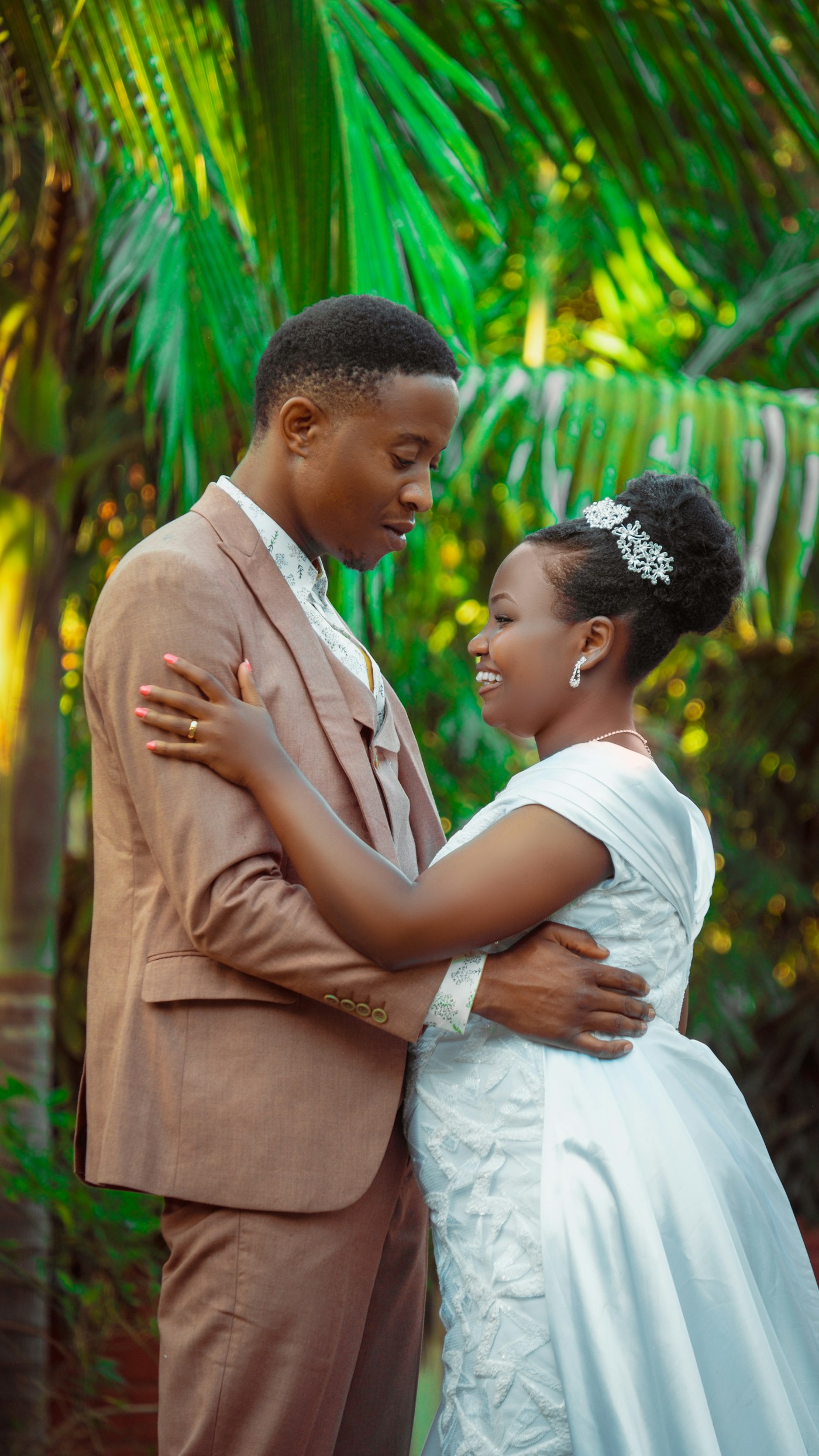 A couple embracing in a tropical garden